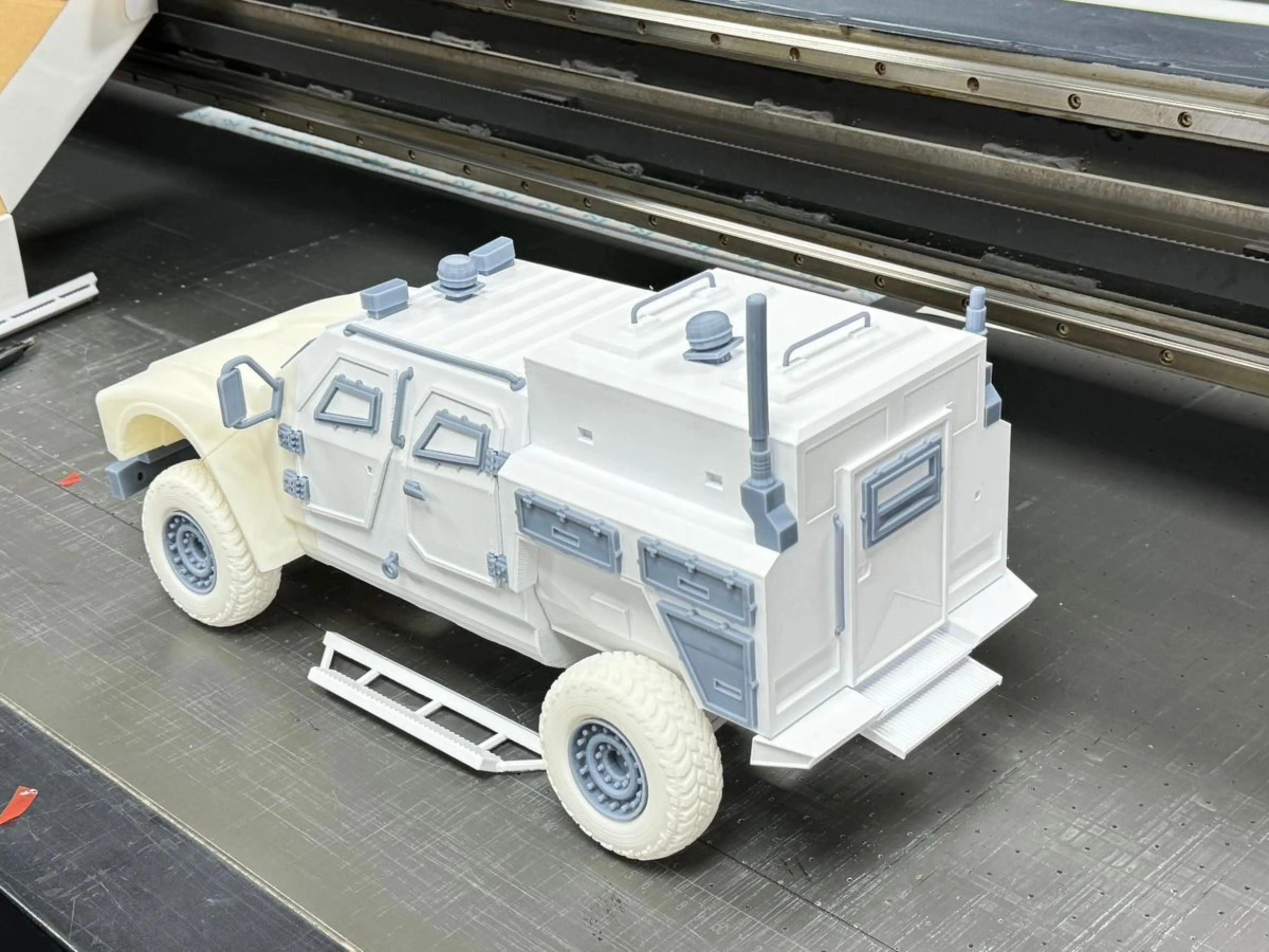 Bare 3D-printed APC scale model on the printer bed, side / rear view