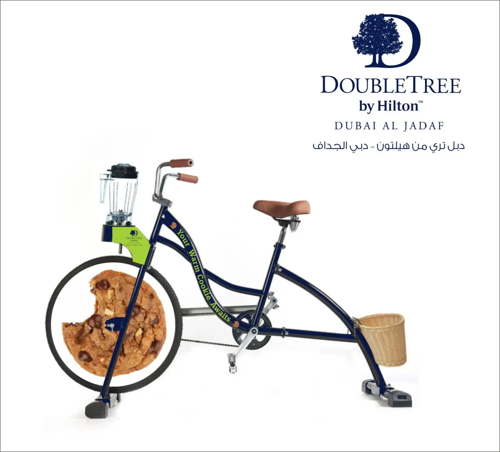 Design mockup of the DoubleTree blender bike: navy frame, cookie wheel disc, lime brand plate, Your Warm Cookie Awaits lettering